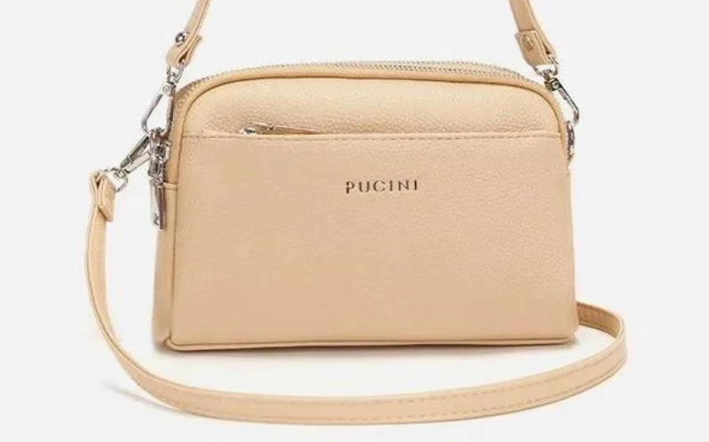 Người mẫu sang trọng bên cạnh chiếc túi Puccini